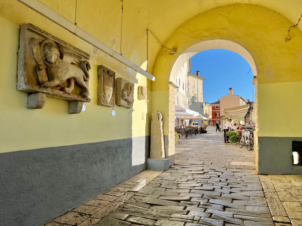Inside the arched New Gate in Old Town Motovun, Croatia, is a lapidarium.