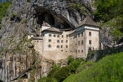 Predjama Castle in Slovenia is built into a cave in a mountain.